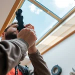 Expert Velux repairs with a technician displaying craftsmanship and care in skylight maintenance.