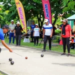 FOPI Kota Manado community engaging in a vibrant petanque game.